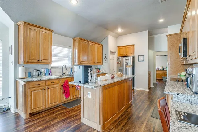 a view of a dining room with furniture and window