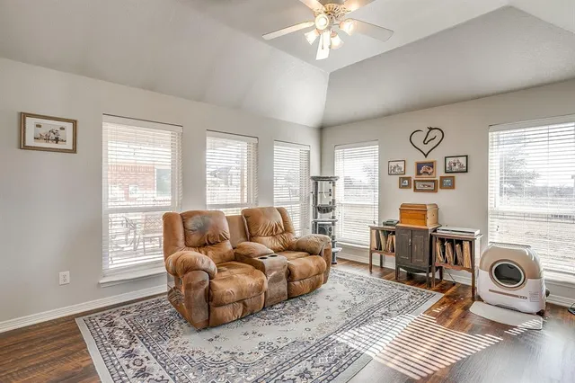 a bedroom with furniture and a book shelf