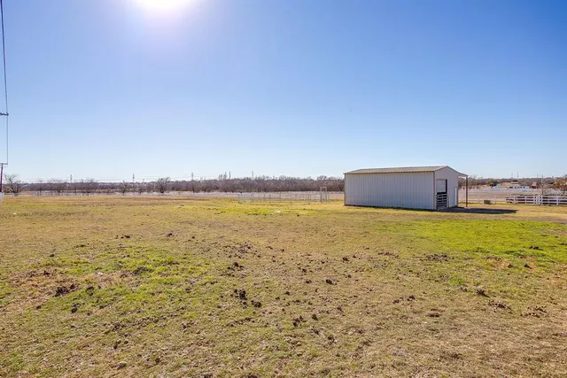 an aerial view of residential houses with city view