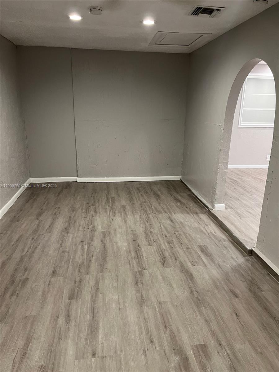 417 Southwest 8th Avenue Delray Beach, FL 33444 - Photo 12 of 18 a view of a room with wooden floor and window