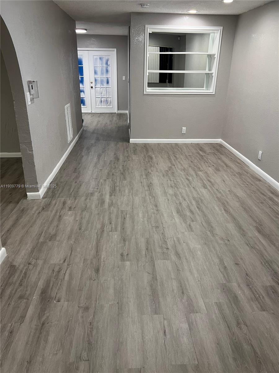 417 Southwest 8th Avenue Delray Beach, FL 33444 - Photo 13 of 18 an empty room with windows