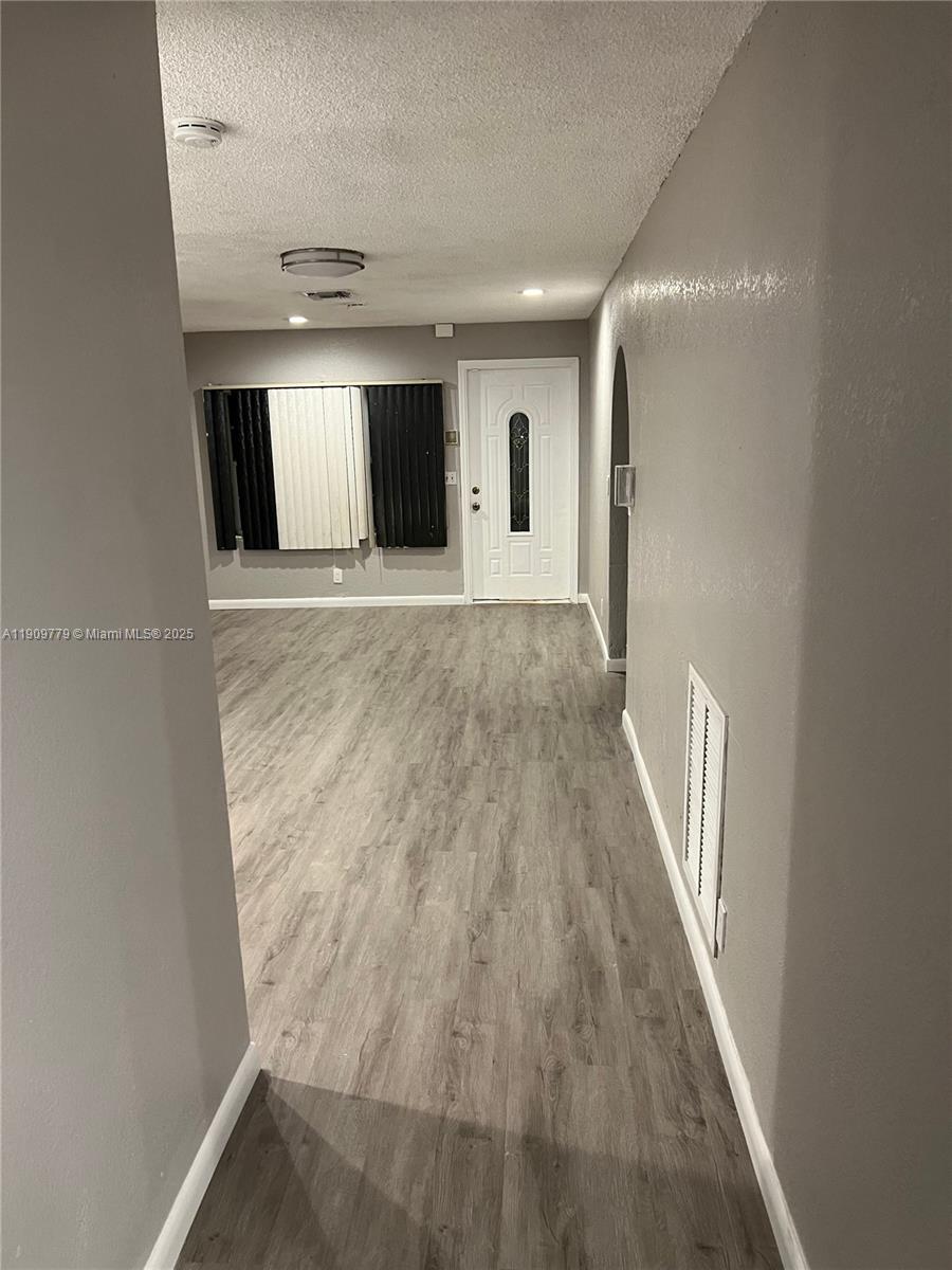 417 Southwest 8th Avenue Delray Beach, FL 33444 - Photo 10 of 18 a view of hallway with wooden floor