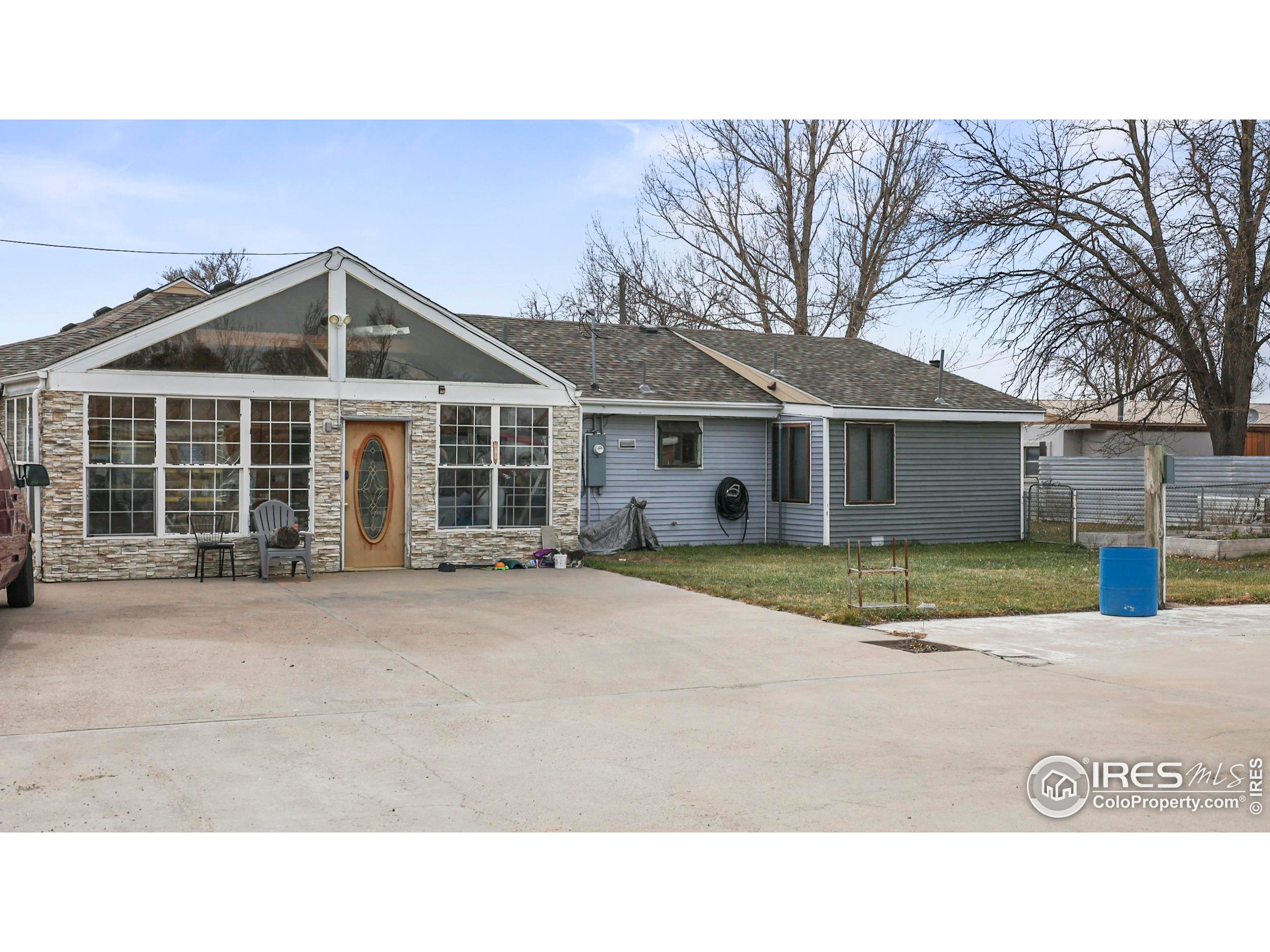 a front view of a house with a garden and porch
