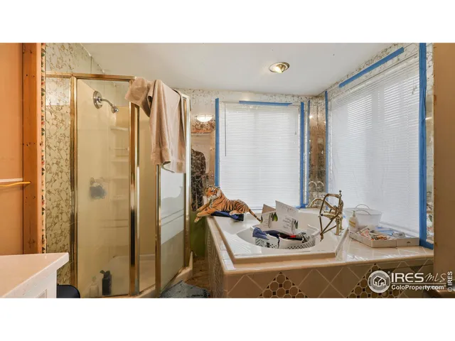 a bathroom with a tub and a sink