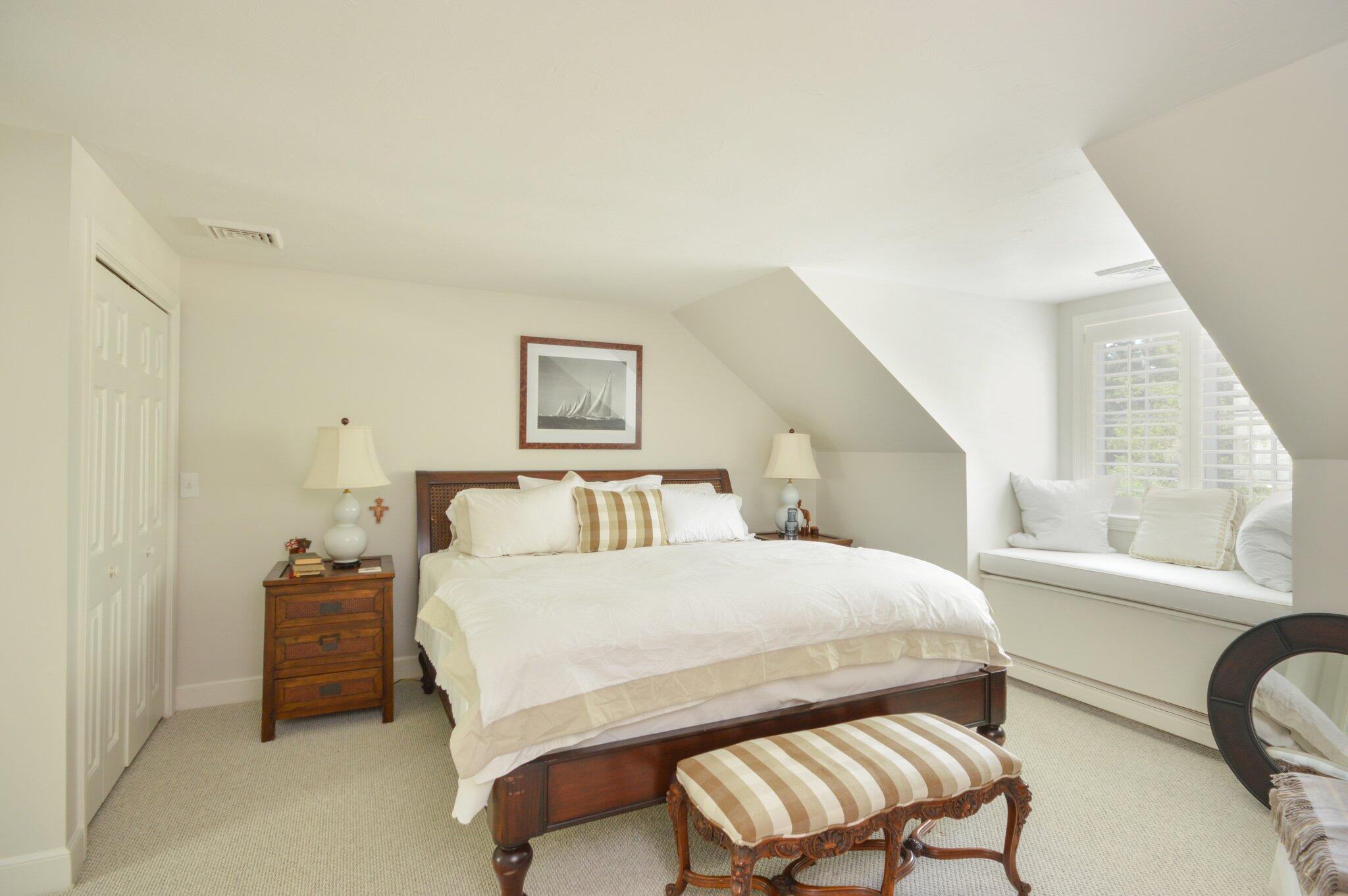 53 Hyde Road Centerville, MA 02632 - Photo 13 of 17 a bedroom with a bed and a chair