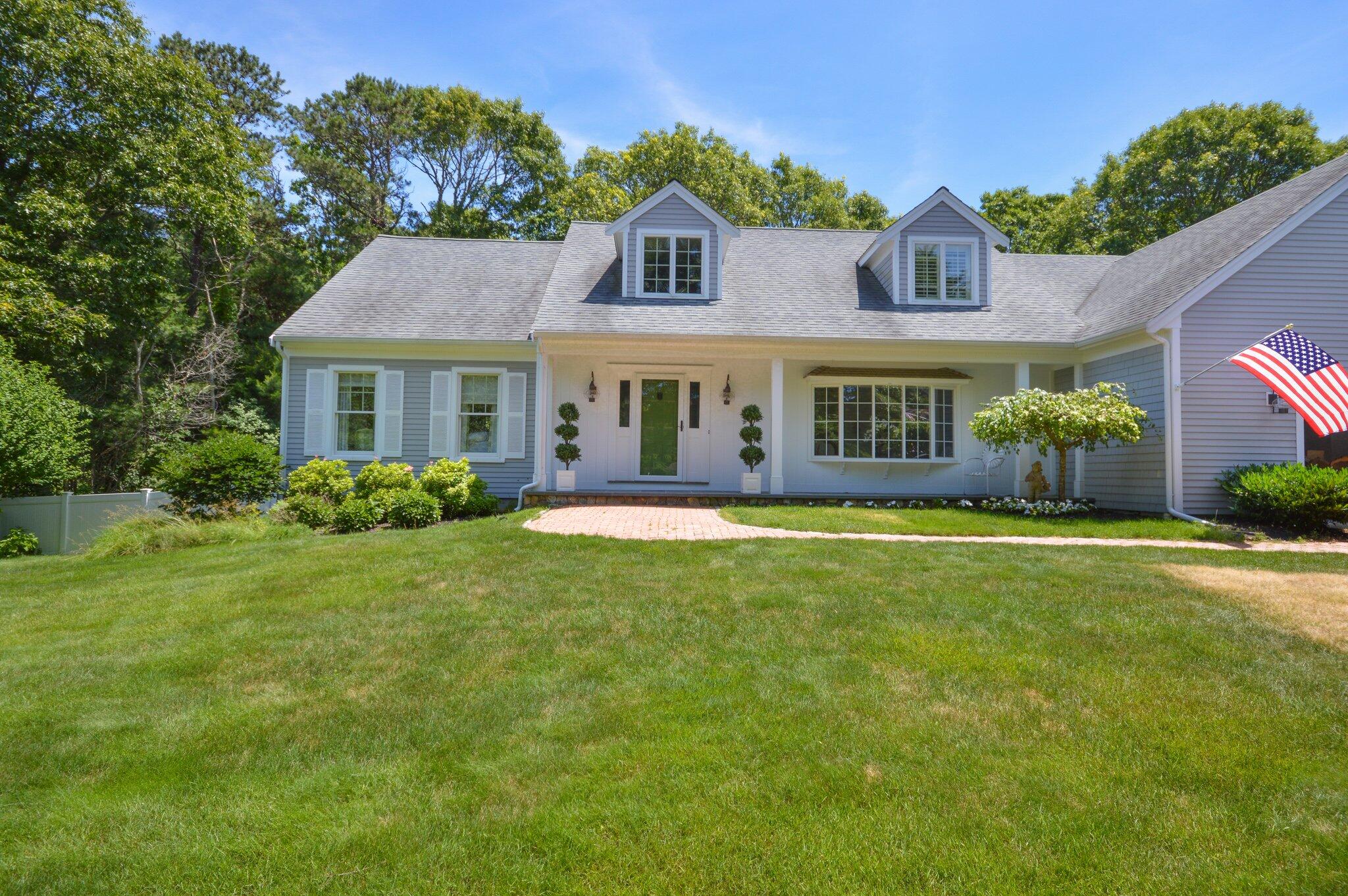 53 Hyde Road Centerville, MA 02632 - Photo 3 of 17 a front view of a house with garden