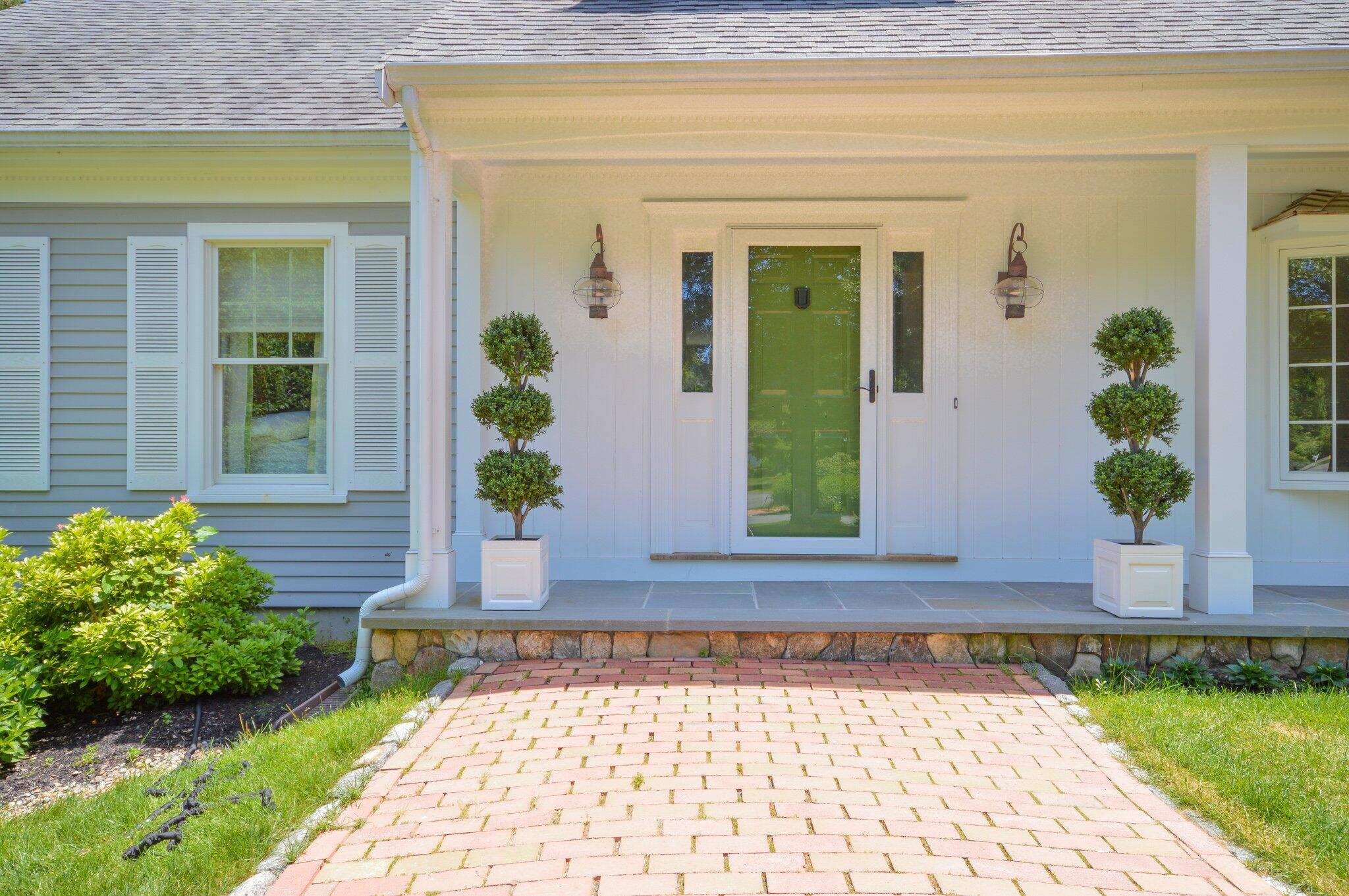 53 Hyde Road Centerville, MA 02632 - Photo 4 of 17 a front view of a house with a yard