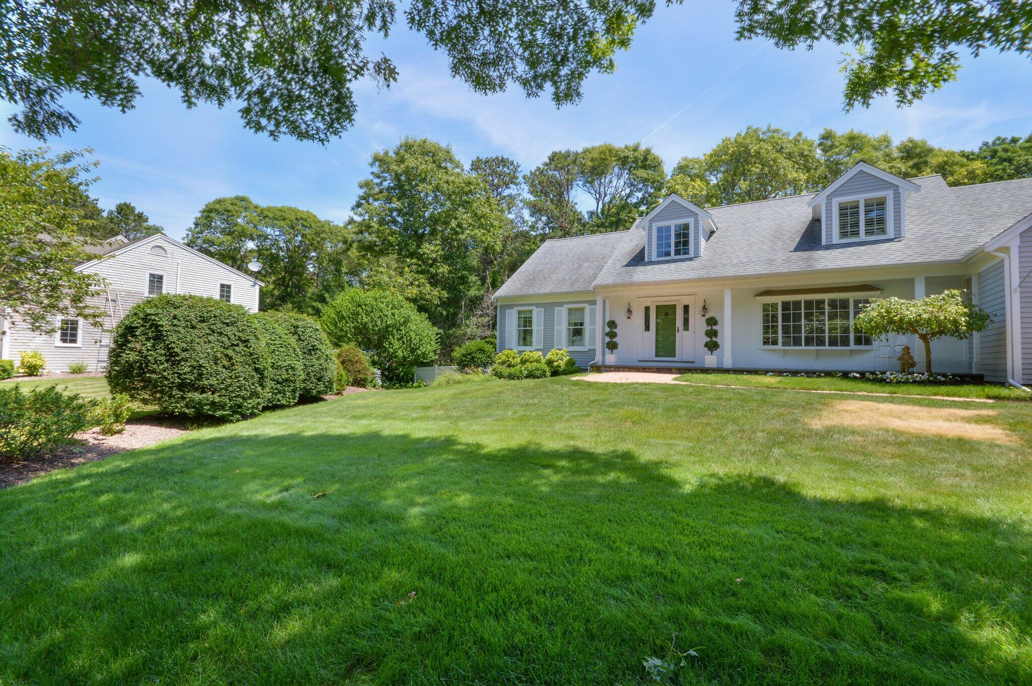 53 Hyde Road Centerville, MA 02632 - Photo 5 of 17 a house with swimming pool in front of it