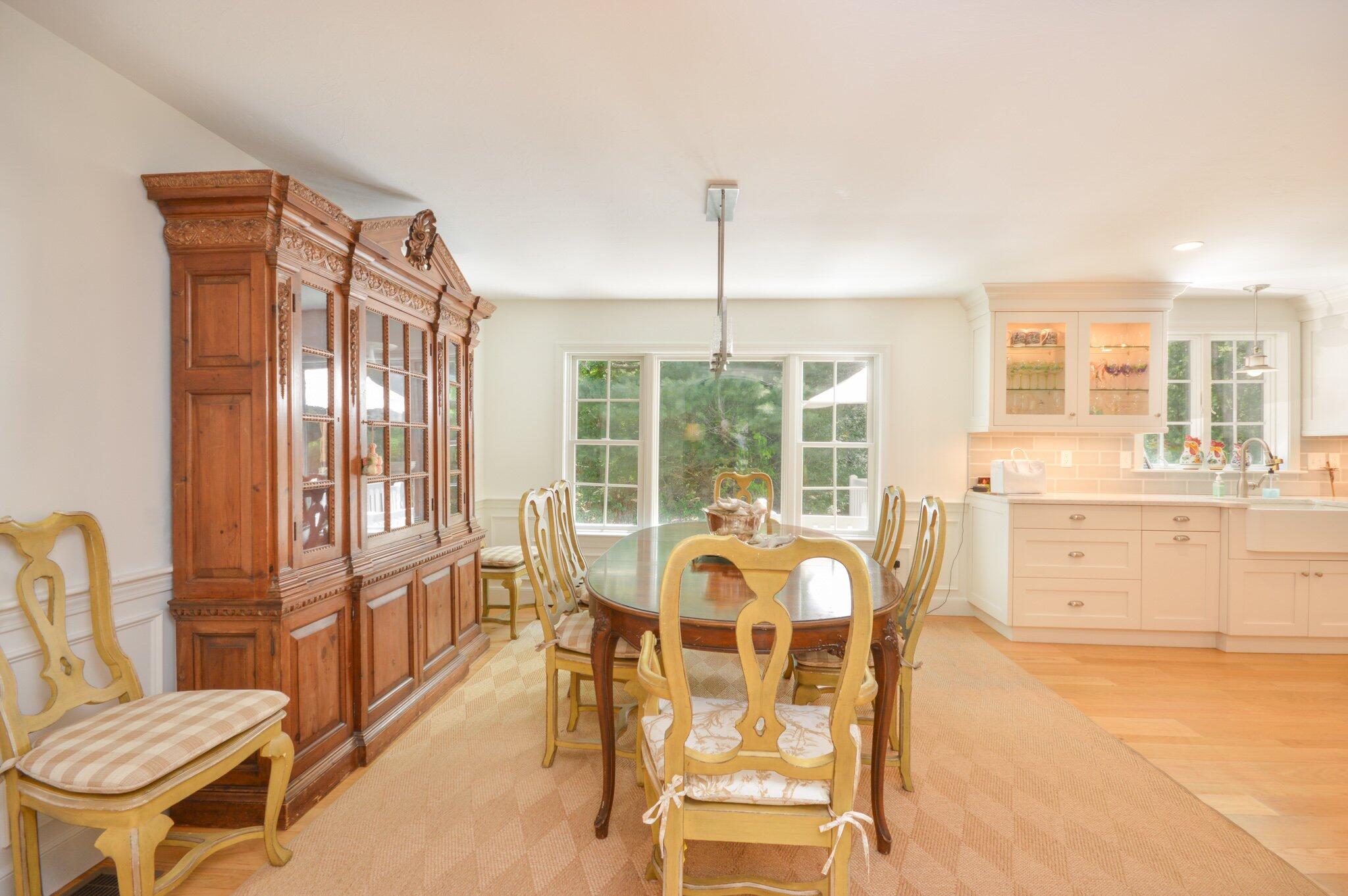 53 Hyde Road Centerville, MA 02632 - Photo 8 of 17 a view of a dining room with furniture water view and wooden floor