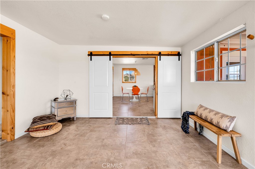 55850 Shannon Road Landers, CA 92285 - Photo 11 of 66 a view of living room with furniture and a gate
