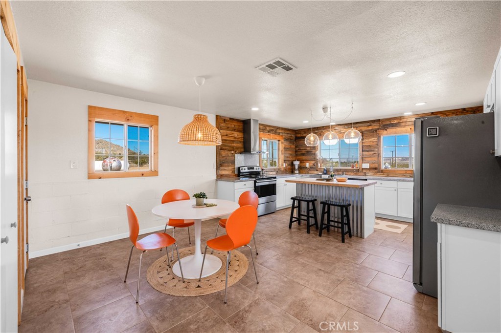 55850 Shannon Road Landers, CA 92285 - Photo 12 of 66 a view of a dining room with furniture