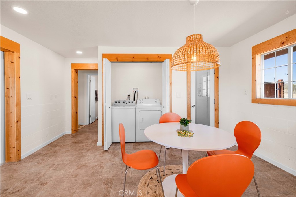 55850 Shannon Road Landers, CA 92285 - Photo 18 of 66 a view of a dining room with furniture and wooden floor