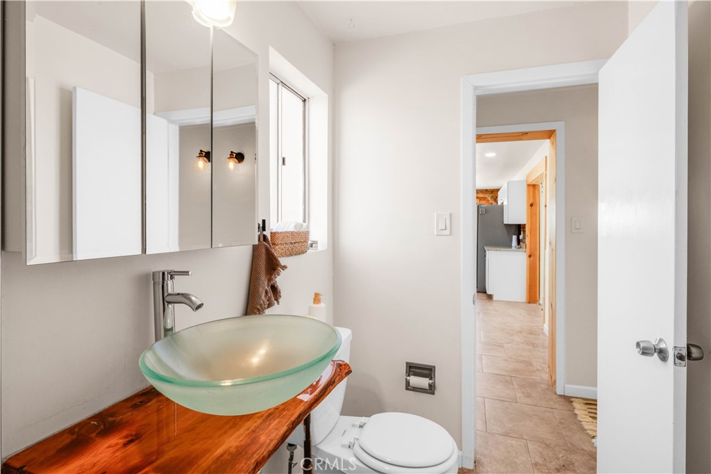 55850 Shannon Road Landers, CA 92285 - Photo 26 of 66 a bathroom with a sink a toilet and shower