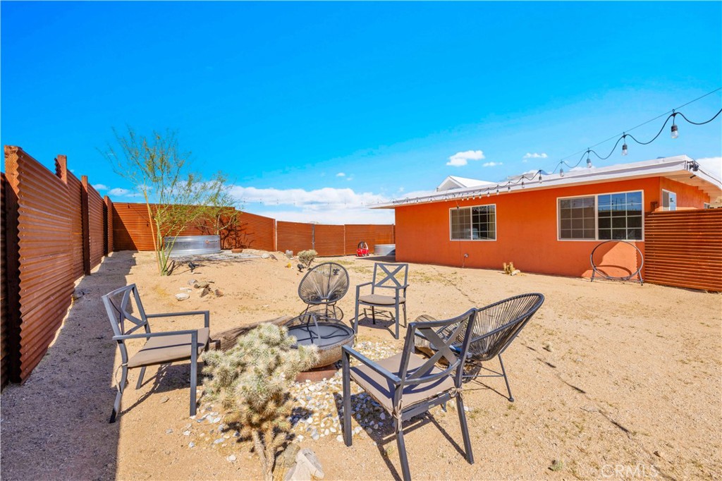 55850 Shannon Road Landers, CA 92285 - Photo 33 of 66 a terrace of a house with table and chairs