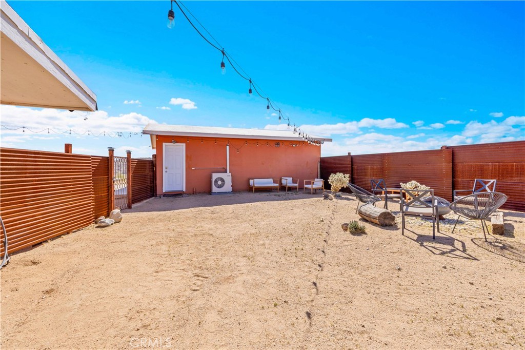 55850 Shannon Road Landers, CA 92285 - Photo 34 of 66 a view of a backyard with sitting area