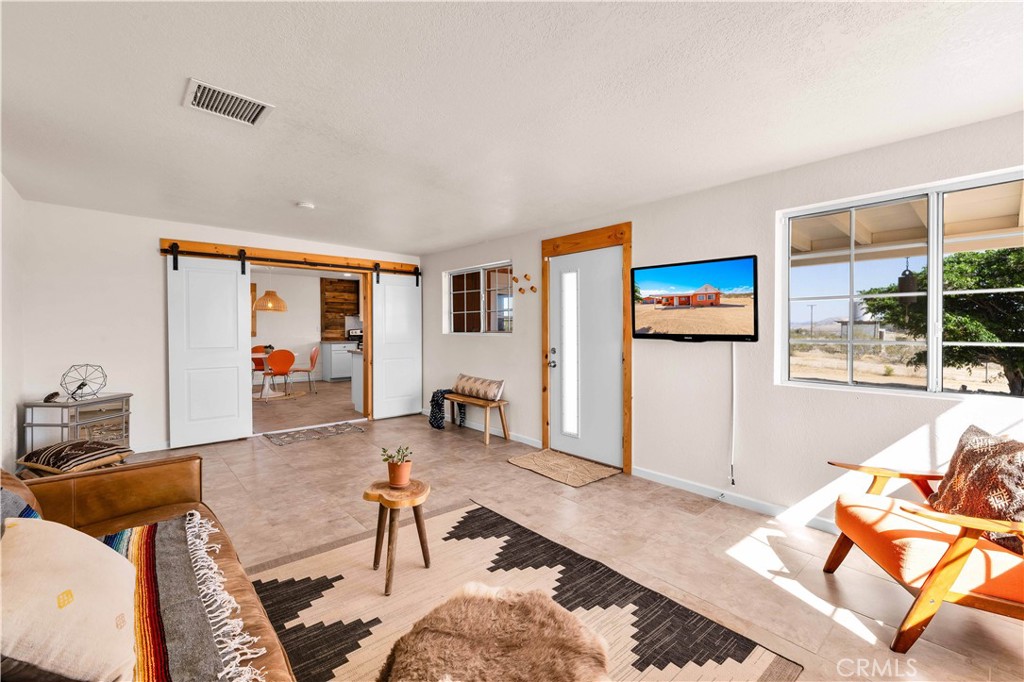 55850 Shannon Road Landers, CA 92285 - Photo 9 of 66 a living room with furniture and a table