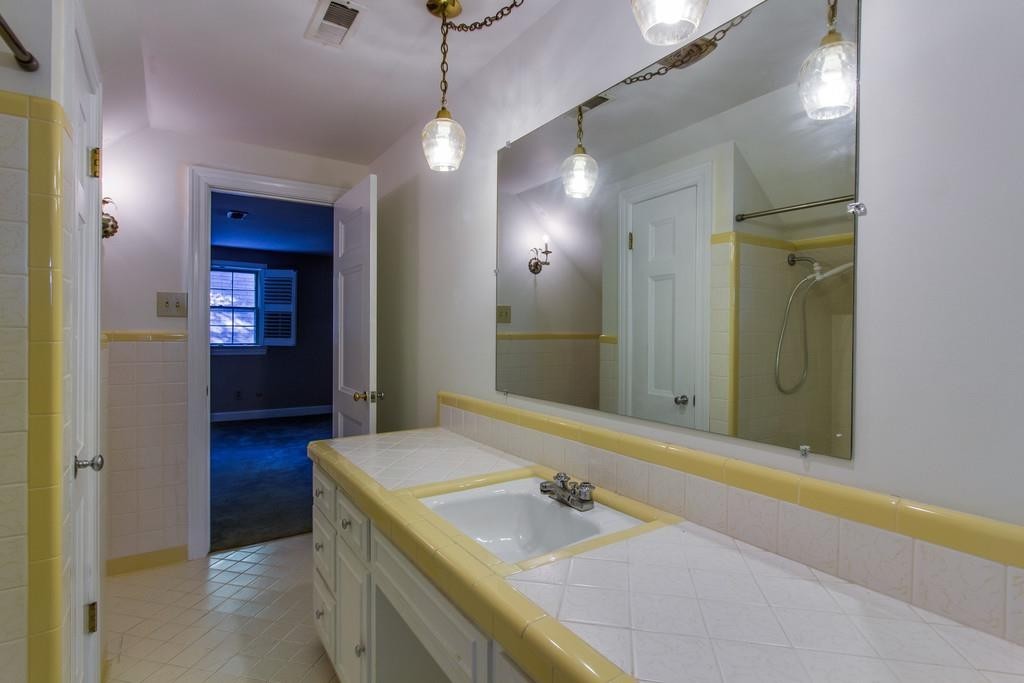 1501 Hillsboro Road Franklin, TN 37069 - Photo 19 of 24 a bathroom with a sink and a mirror
