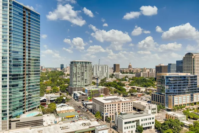 a view of a city with tall buildings
