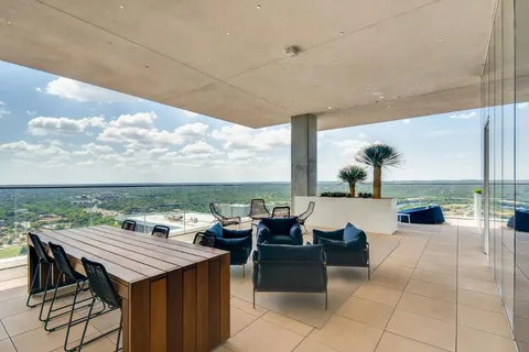 a view of a swimming pool with a lounge chair