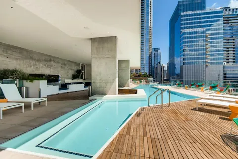 a view of swimming pool with outdoor seating