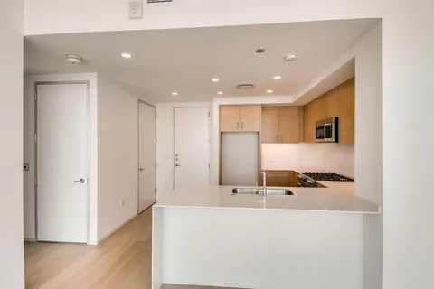 a large bathroom with a sink and a large mirror