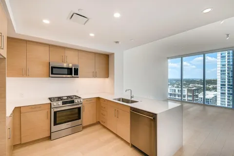 a kitchen with a sink stove and microwave