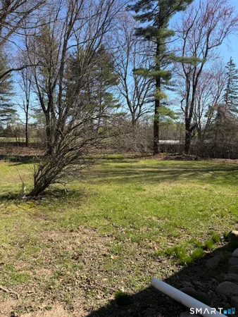a view of a yard with an outdoor space