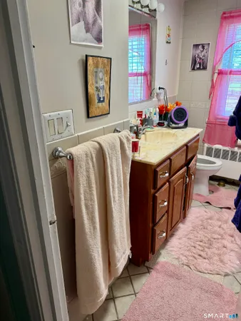a bathroom with a sink a mirror and shower
