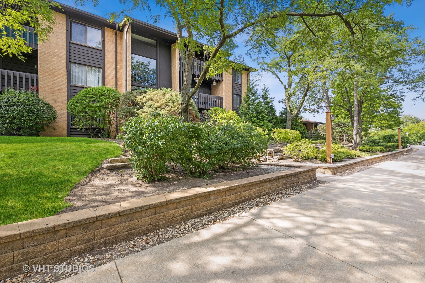6135 Knoll Wood Road, Unit 13101 Willowbrook, IL 60527 - Photo 11 of 12 a front view of a house with a yard