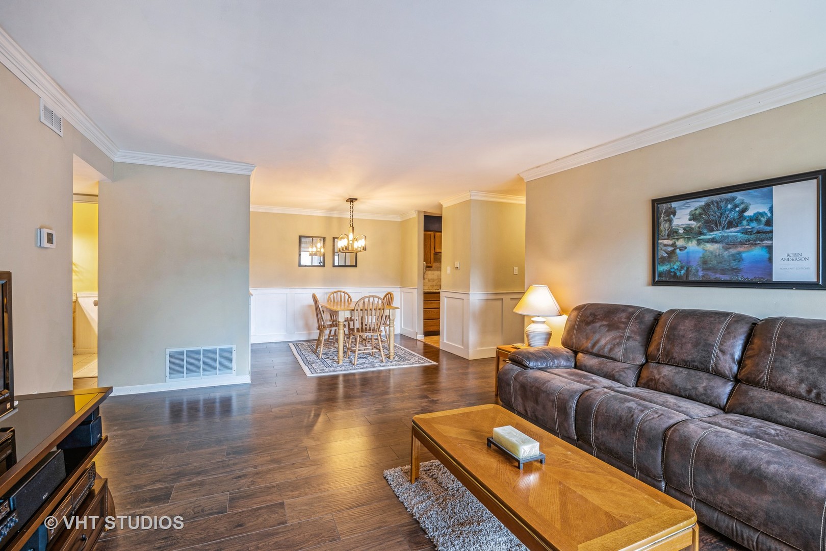 6135 Knoll Wood Road, Unit 13101 Willowbrook, IL 60527 - Photo 4 of 12 a living room with furniture and a flat screen tv