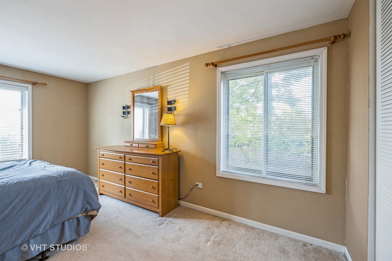 6135 Knoll Wood Road, Unit 13101 Willowbrook, IL 60527 - Photo 8 of 12 a bedroom with a bed and wooden floor