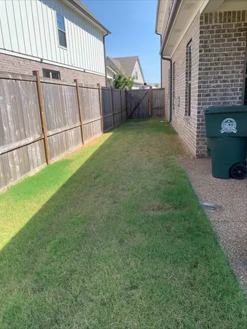a view of a swimming pool with an outdoor seating