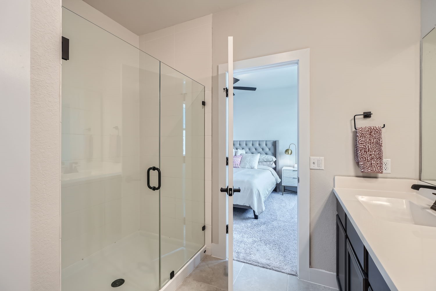 8319 Laughlin Lane Austin, TX 78744 - Photo 19 of 26 Full en suite bath with dual vanities, large walk-in closet and walk-in shower.