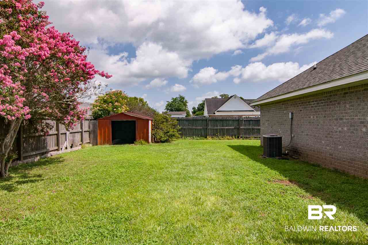 22165 Buck Road Robertsdale, AL 36567 - Photo 32 of 39 Fenced in Backyard