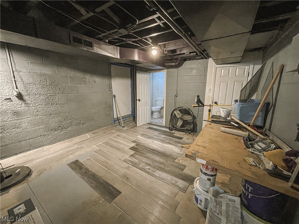 24709 Emery Road Warrensville Heights, OH 44128 - Photo 30 of 34 Basement with light hardwood / wood-style floors