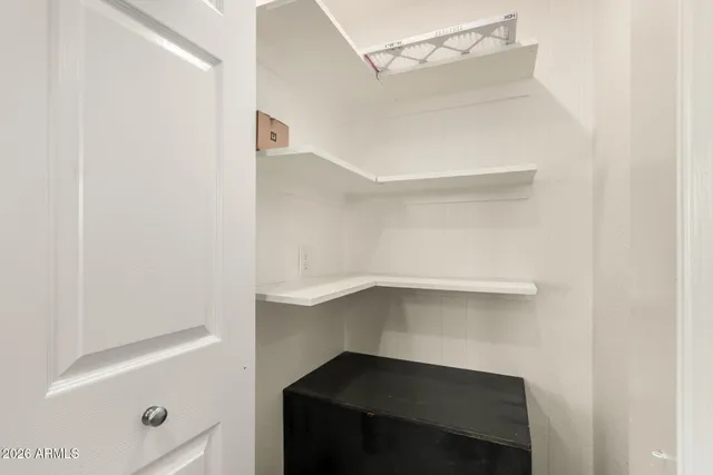 a bed room with a bed and a ceiling fan