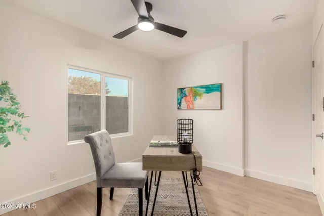 a bathroom with a bathtub a sink a window and vanity