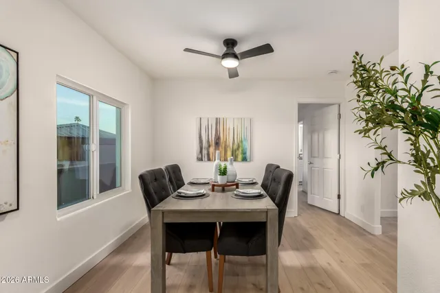 a view of a dining room with furniture and a chandelier
