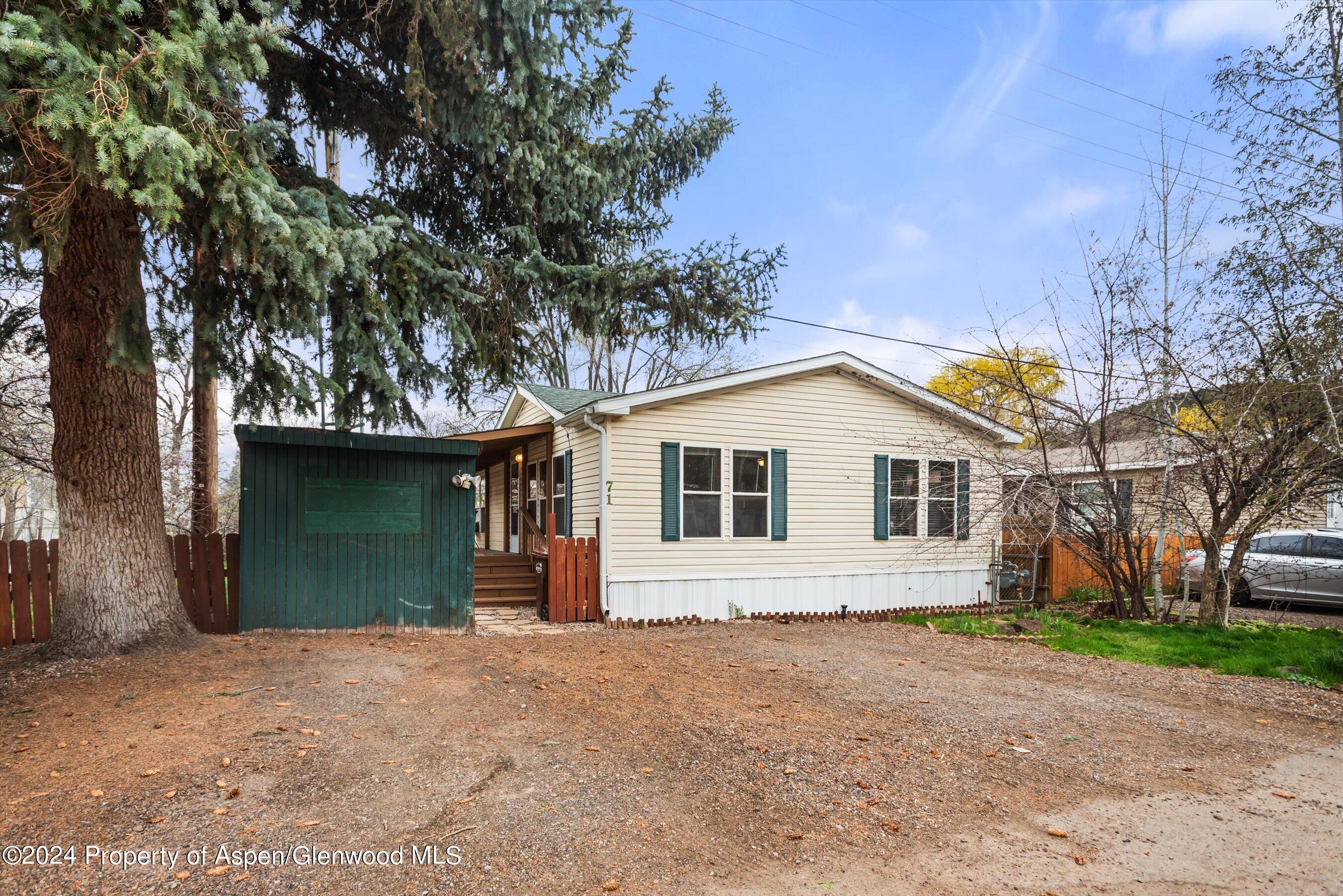 71 Nathan El Jebel, CO 81623 - Photo 28 of 29 a front view of a house with a yard and garage