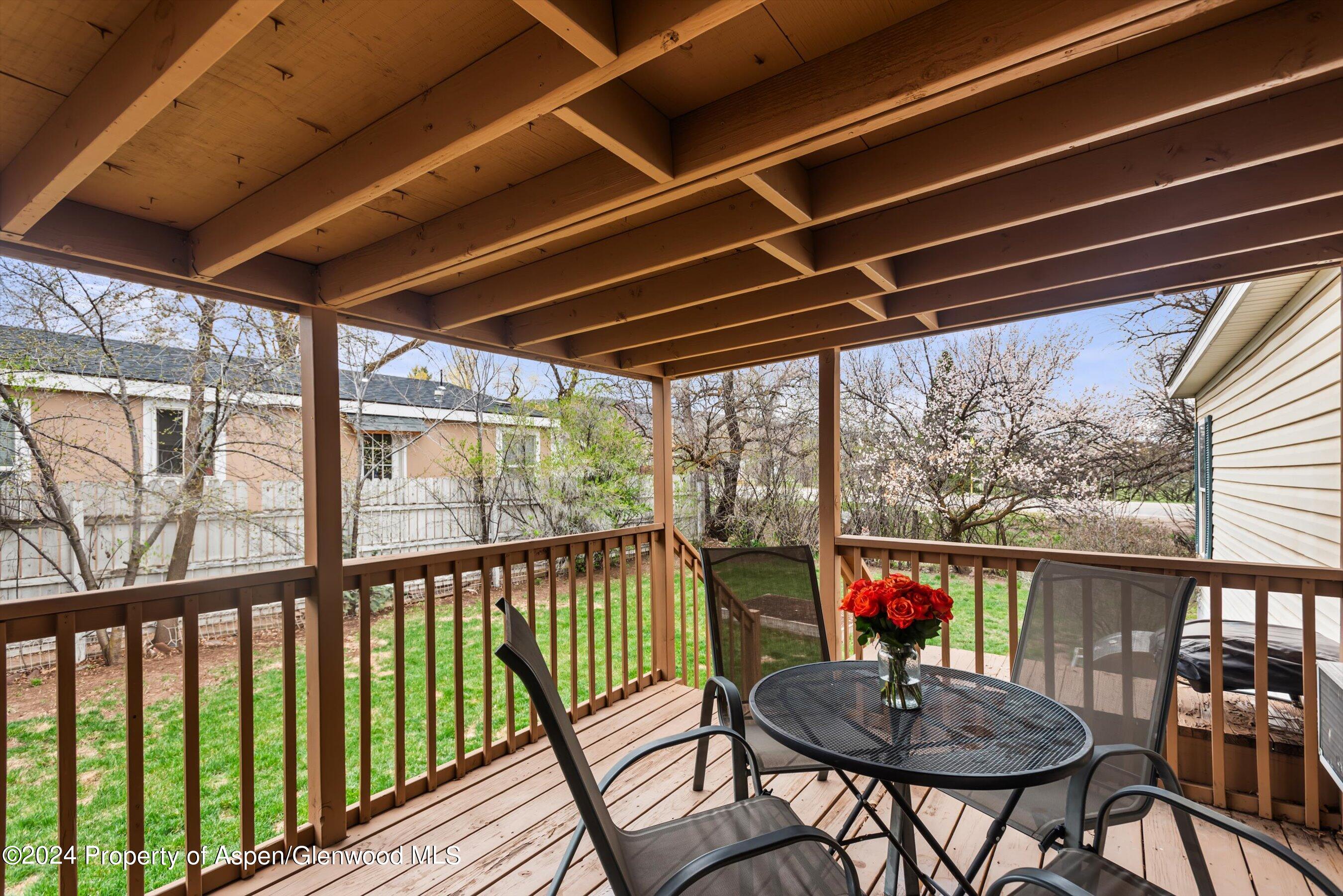 71 Nathan El Jebel, CO 81623 - Photo 3 of 29 a view of a balcony with chairs and wooden floor
