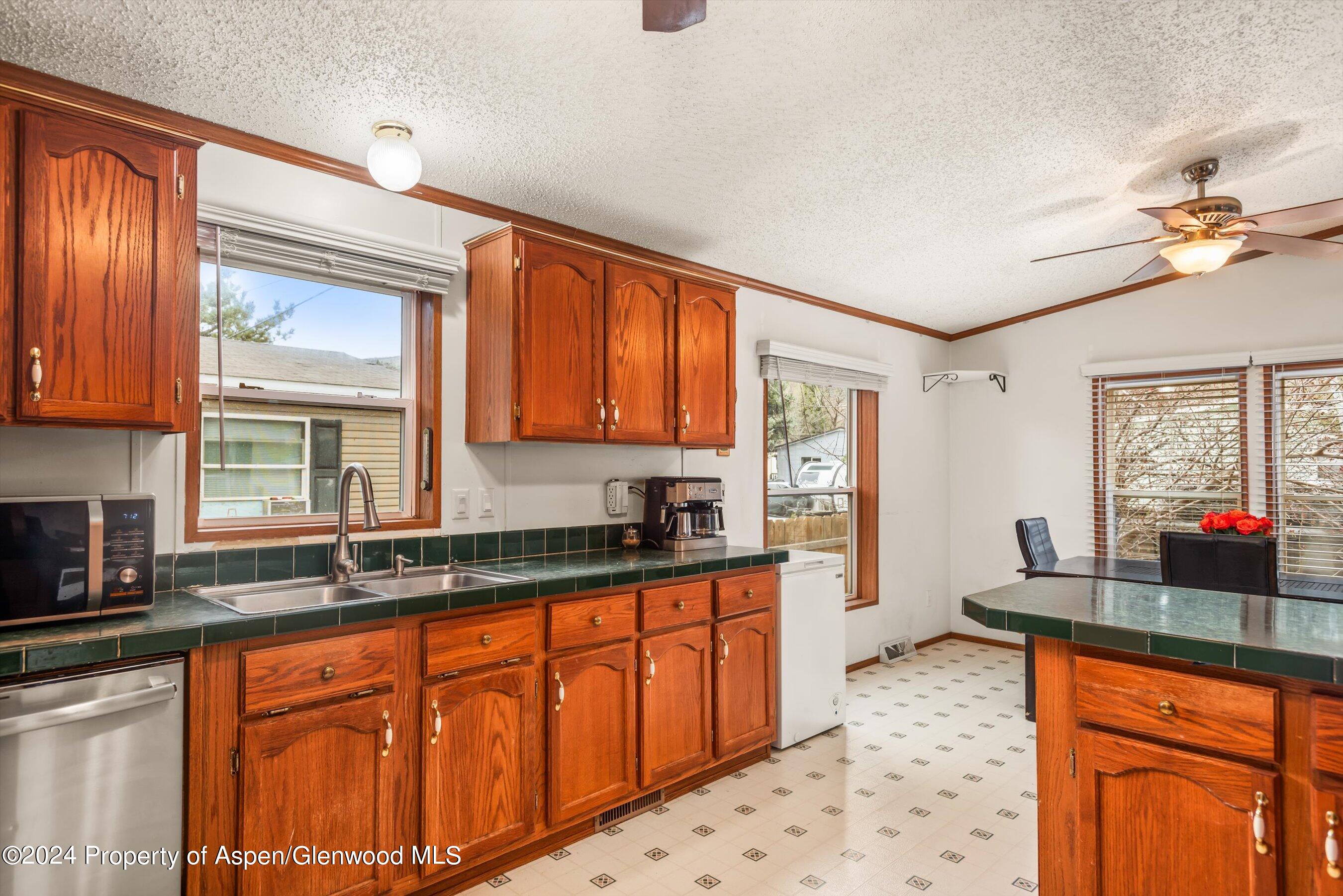 71 Nathan El Jebel, CO 81623 - Photo 5 of 29 a kitchen with granite countertop a sink cabinets and window