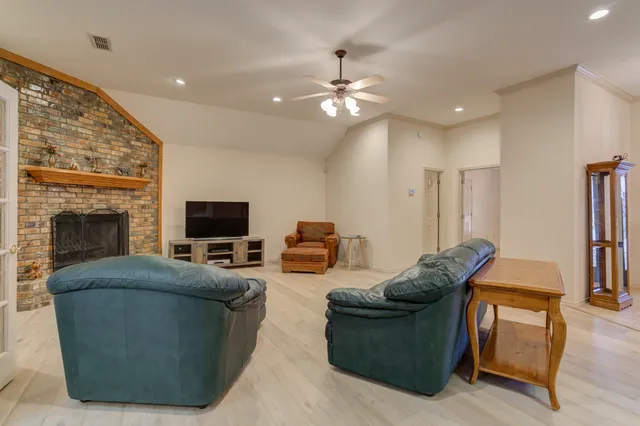 a view of a livingroom with furniture and a fireplace
