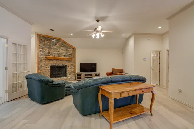a bedroom with furniture and a fireplace