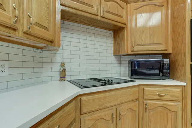 a kitchen with a stove and a sink