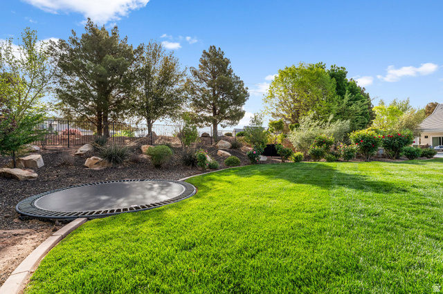 2917 Old Farm Road Washington, UT 84780 - Photo 8 of 105 Fenced yard with a trampoline and a patio area
