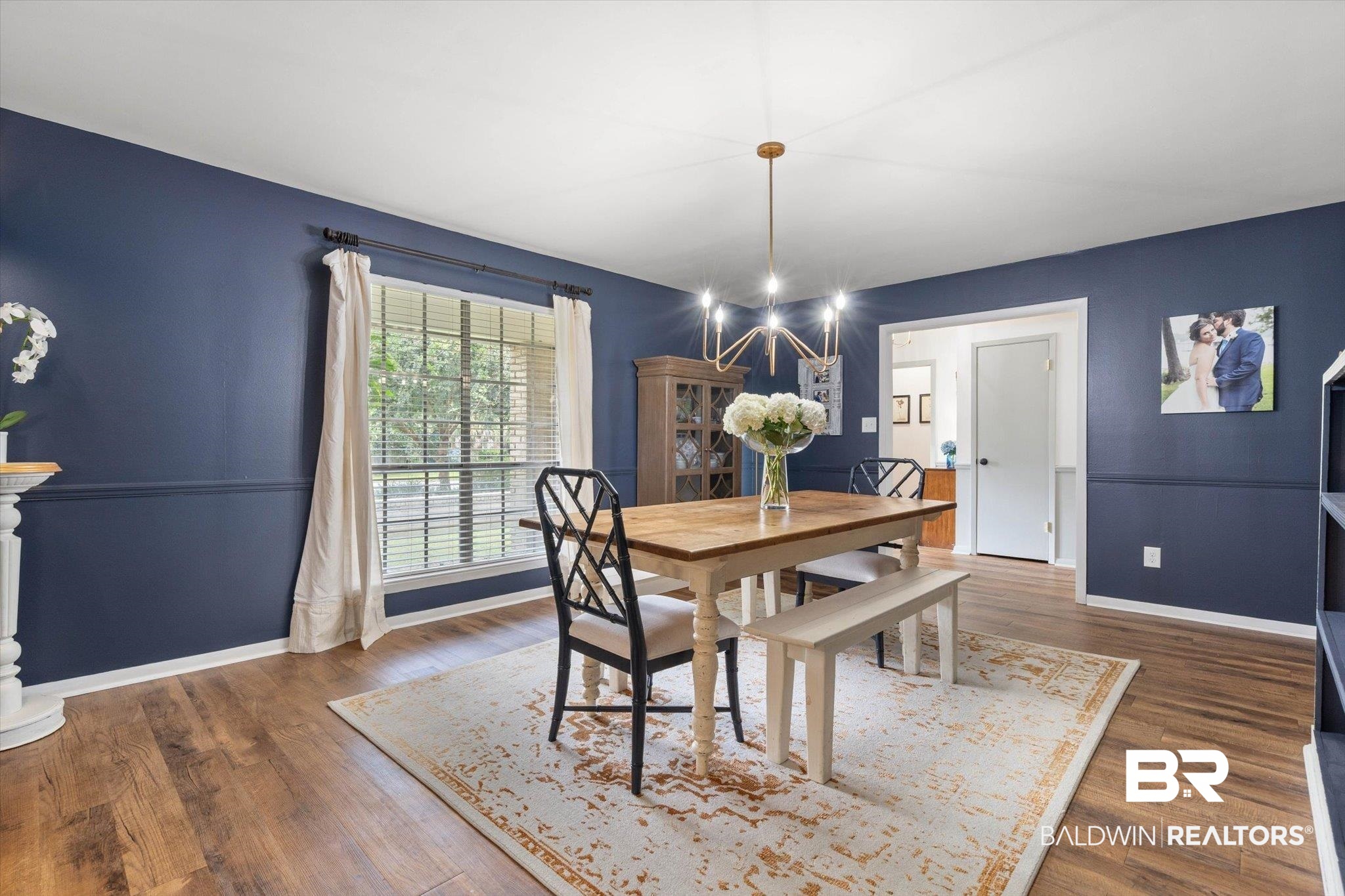 254 Woodlands Avenue Mobile, AL 36607 - Photo 11 of 50 Dining room with dark wood-style floors and a chandelier