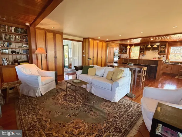 a view of entryway with wooden floor and stairs
