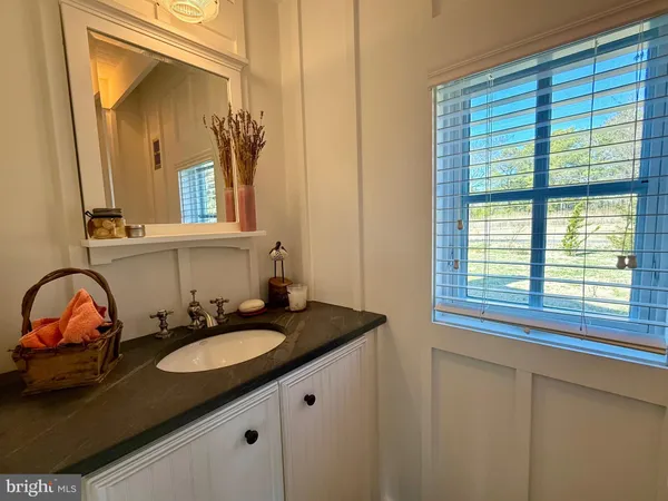 a bedroom with a bed and glass window