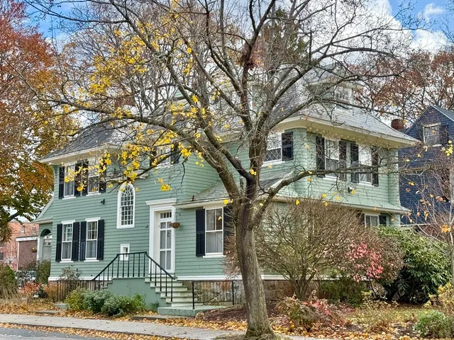 front view of a house with a garden