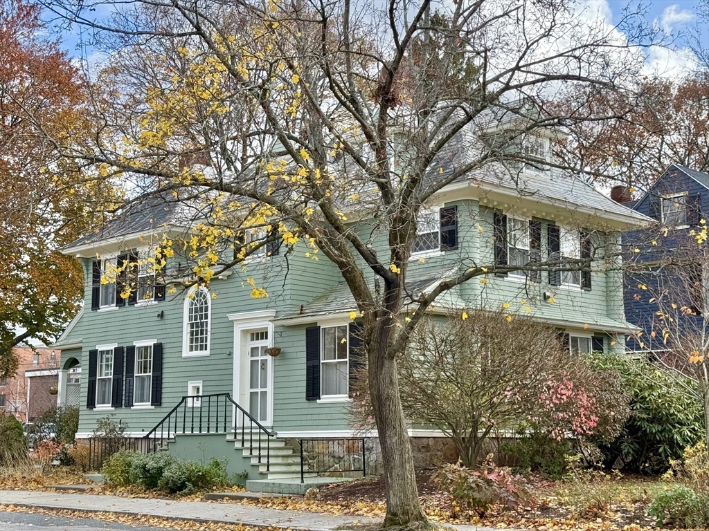 front view of a house with a garden